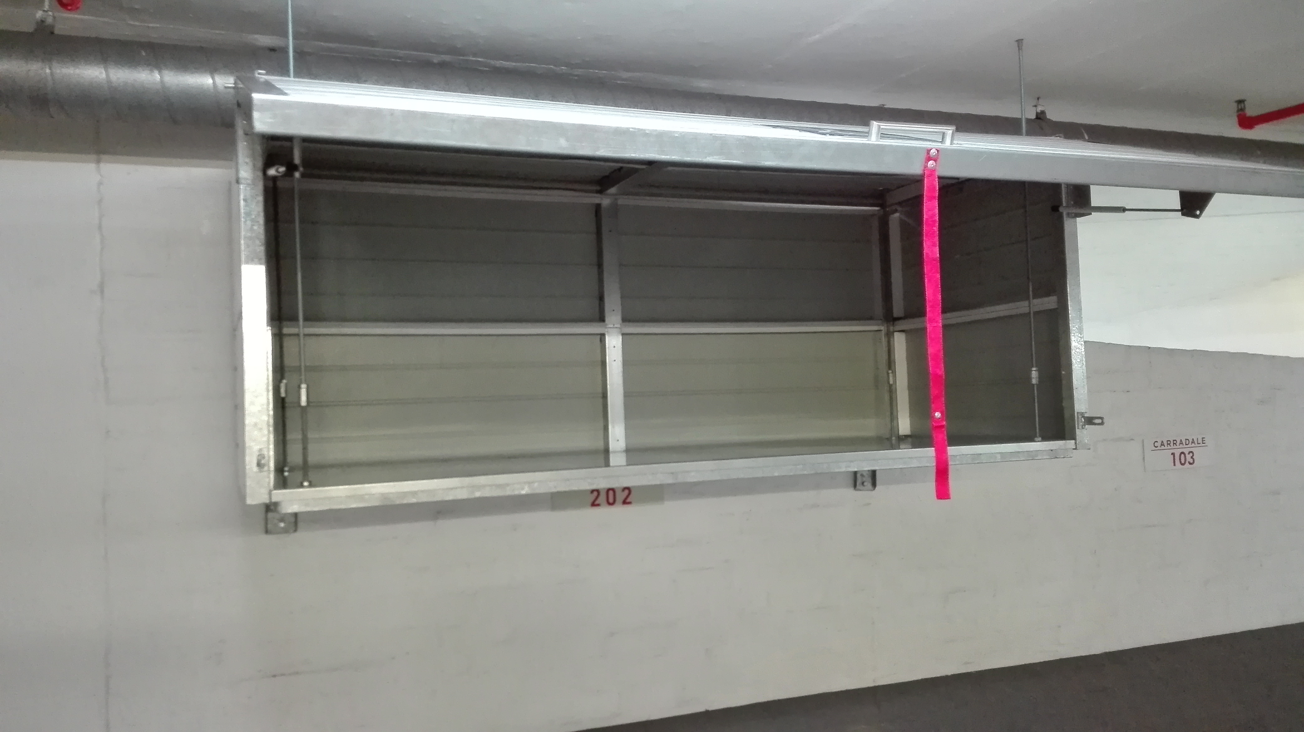 Two BatBox overhead storage units installed side by side