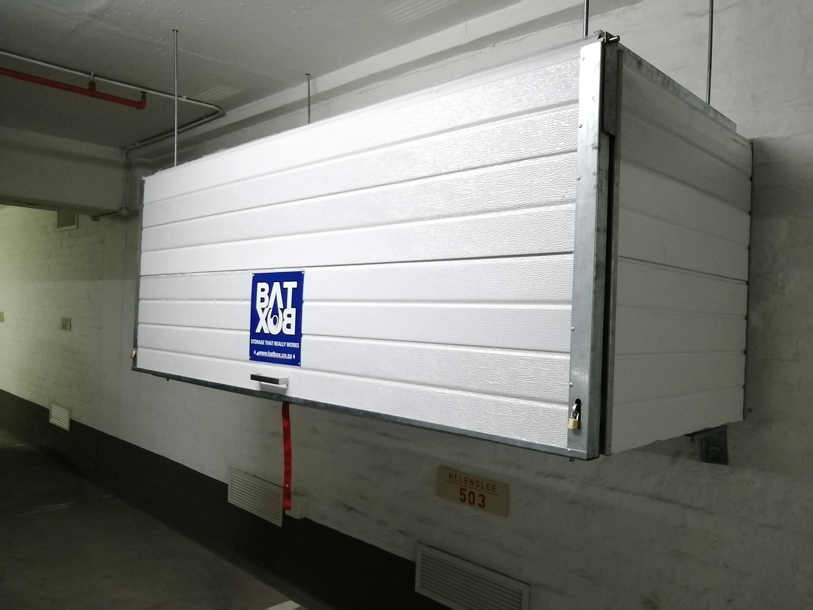 BatBox overhead storage unit technical detail showing pneumatic strut mechanism